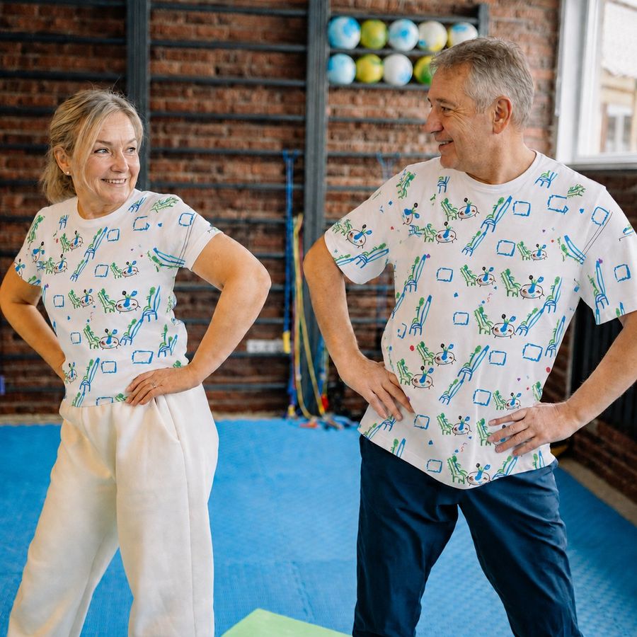 Grandma and Grandpa in matching tees made from that drawing